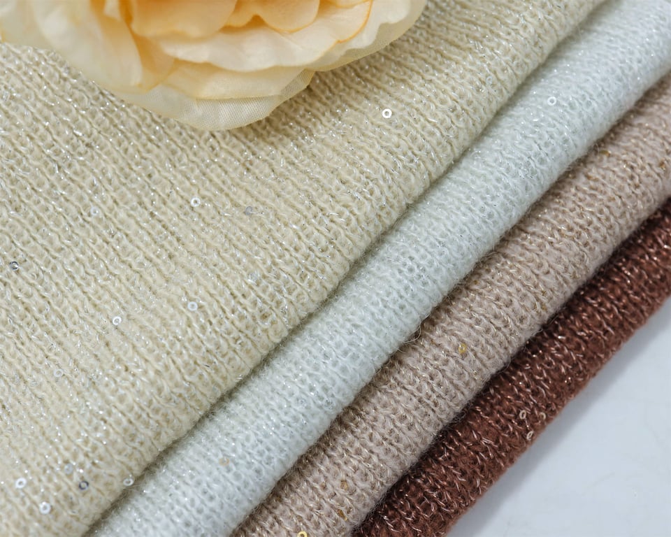 A piece of cloth woven from mohair yarn with a small sequin trim